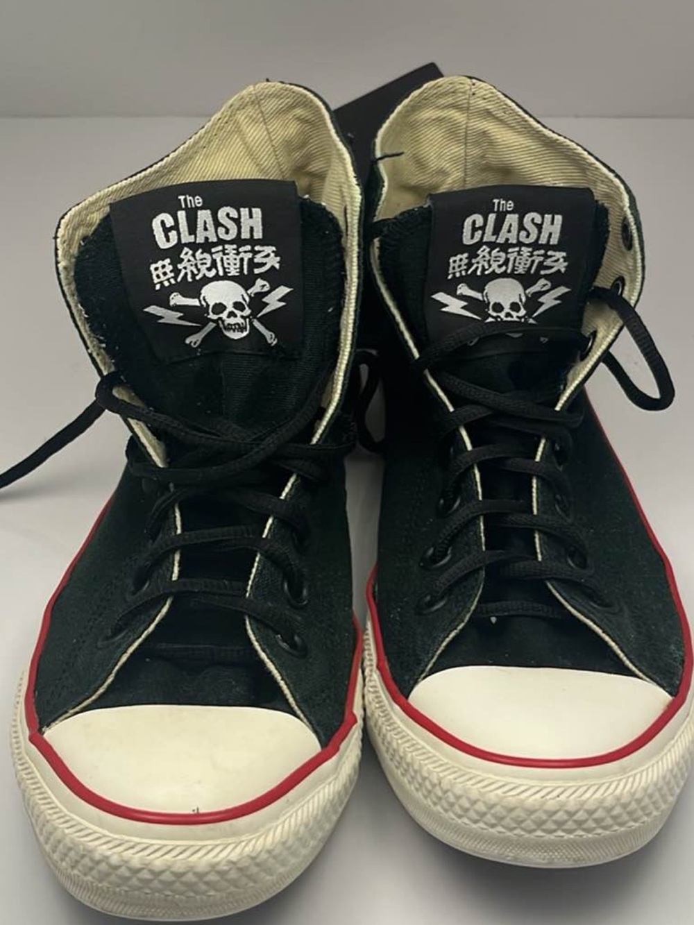 Converse Black High-Top Sneakers with Red Trim and White Toe Caps